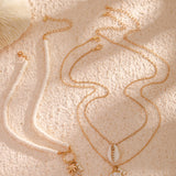 Náhrdelník s přívěskem ve tvaru mušle a slunečnice s více vrstvami