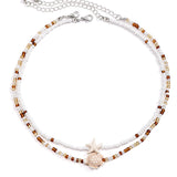 Náhrdelník s mušlí a hvězdicí