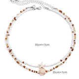 Náhrdelník s mušlí a hvězdicí