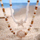 Náhrdelník s mušlí a hvězdicí