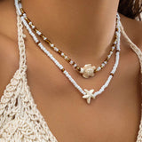 Náhrdelník s mušlí a hvězdicí