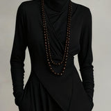 Karolína ❘ Asymetrické plisované maxi šaty s vysokým límcem